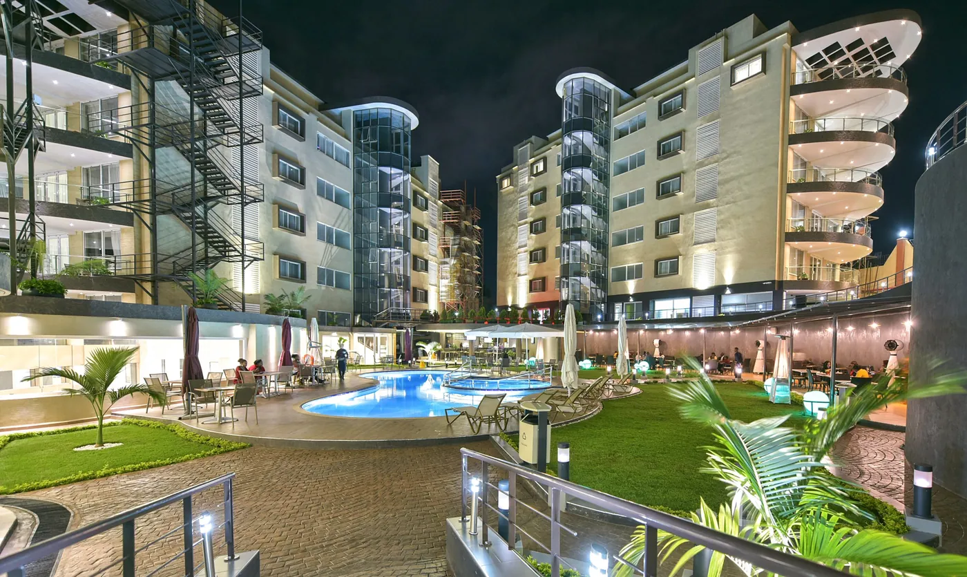 Skyz Hotel Kampala poolside and residences at night
